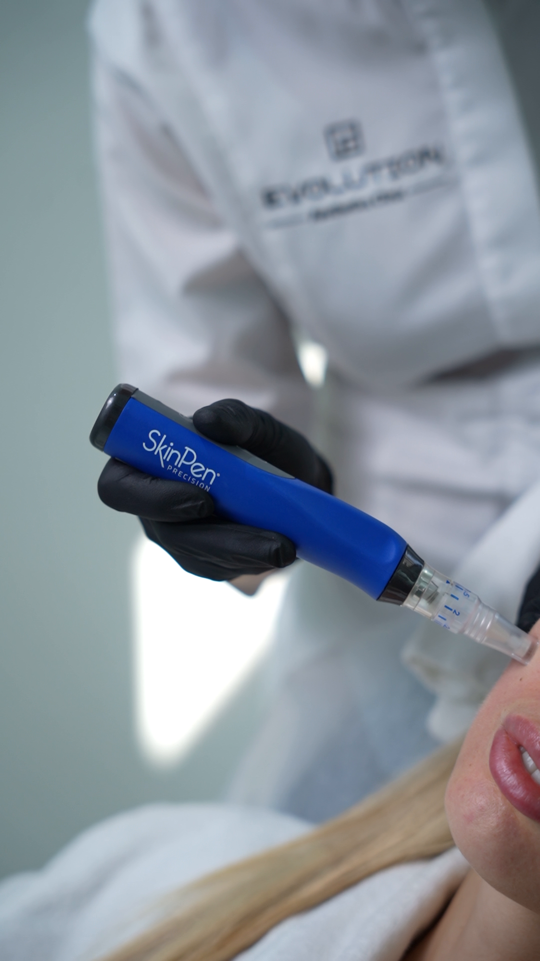 SkinPen microneedling device applied to facial skin