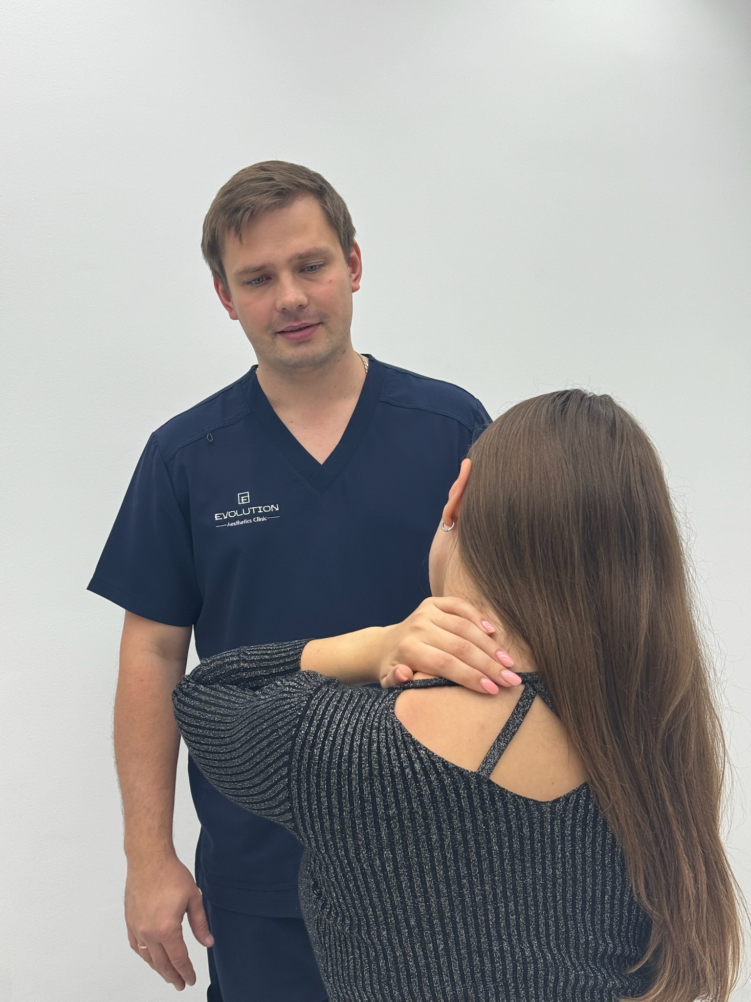 Therapist providing a hands-on shoulder massage