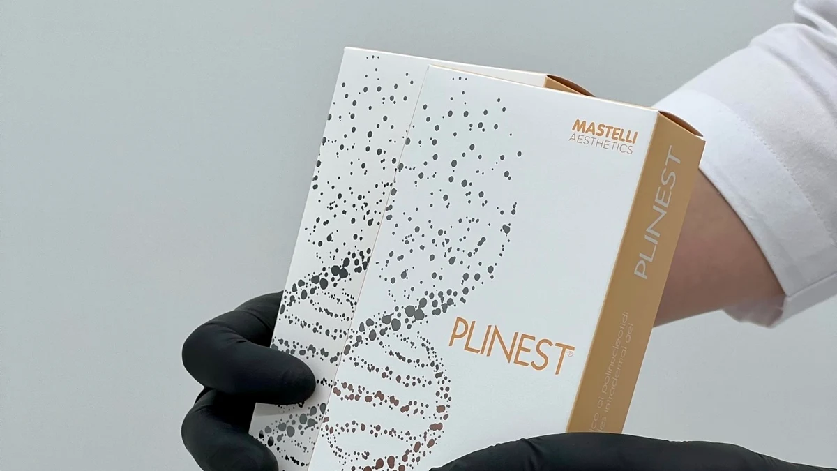 Plinest product packaging held in gloved hands