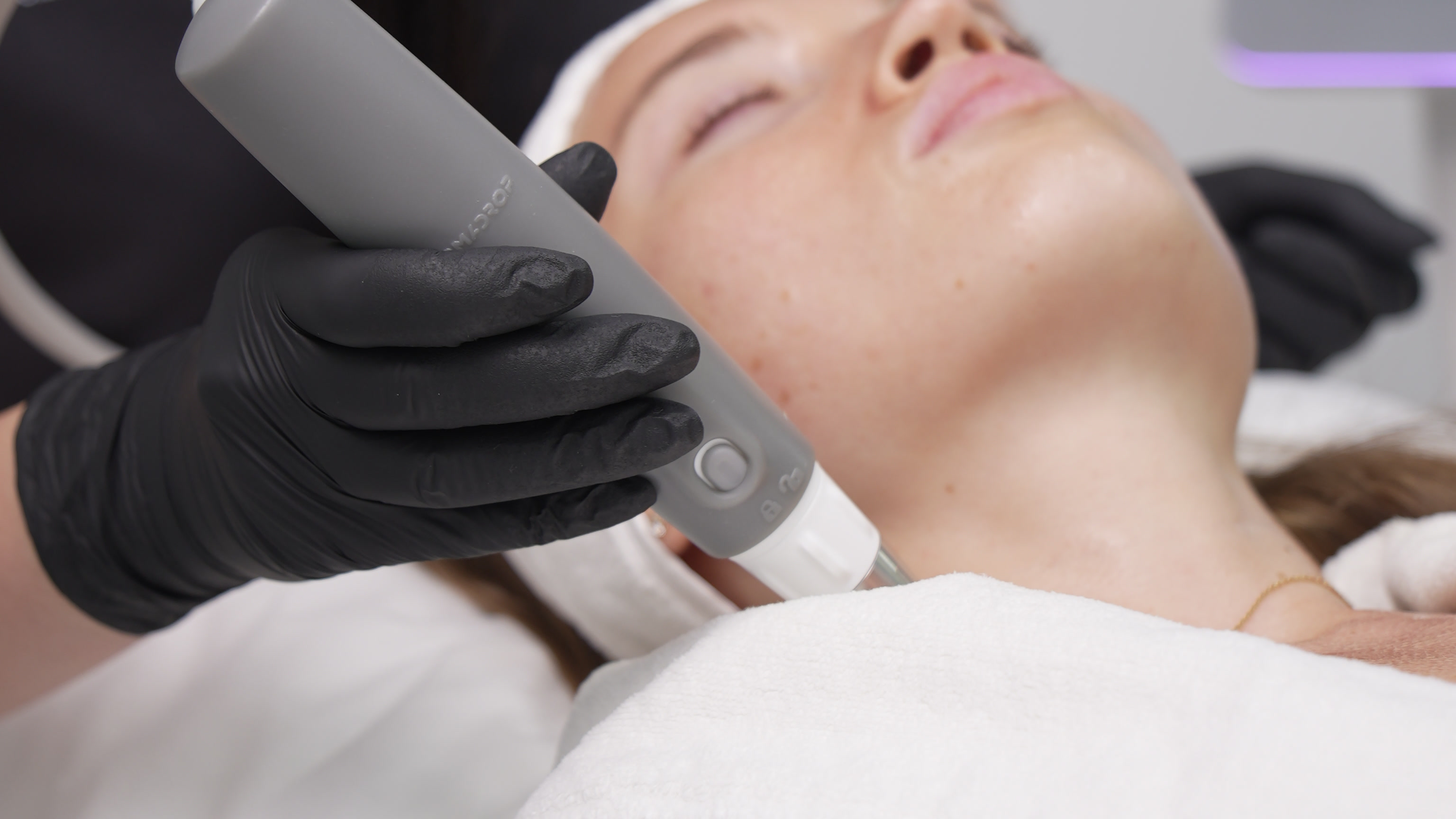 Dermadrop handpiece applied to a patient's jawline
