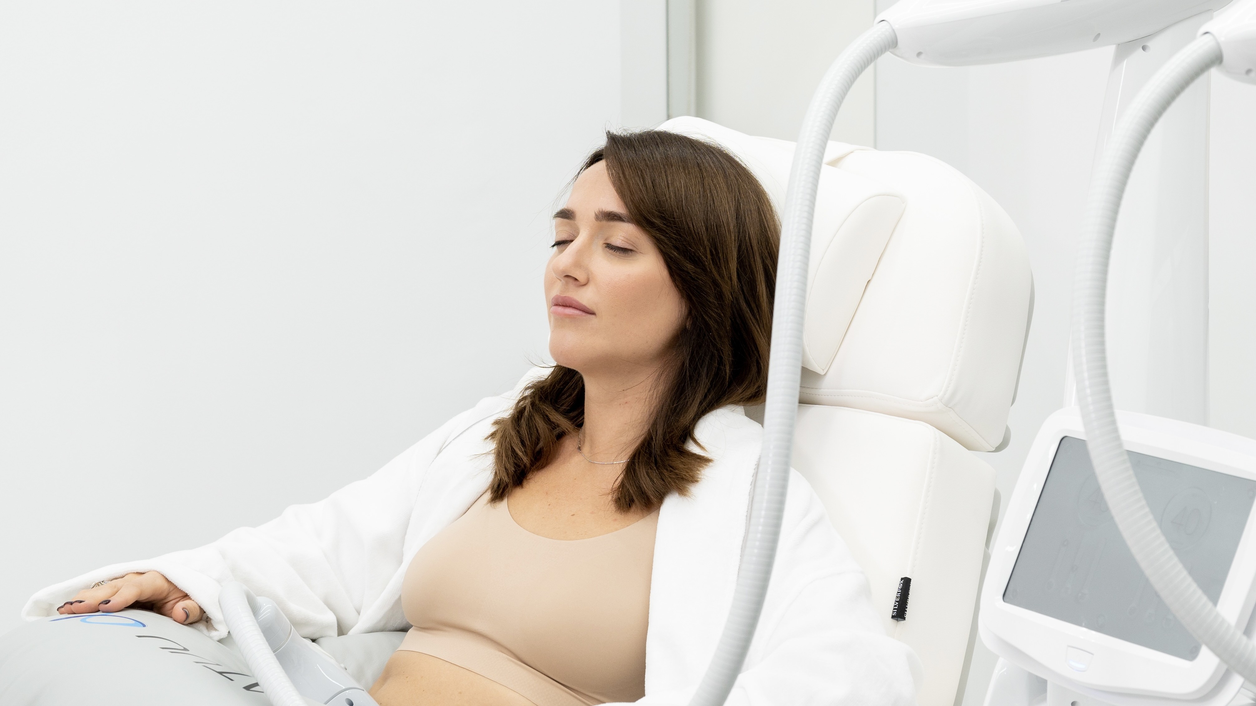 Patient mid-treatment with applicators visible, fits side-effects context; high-res still