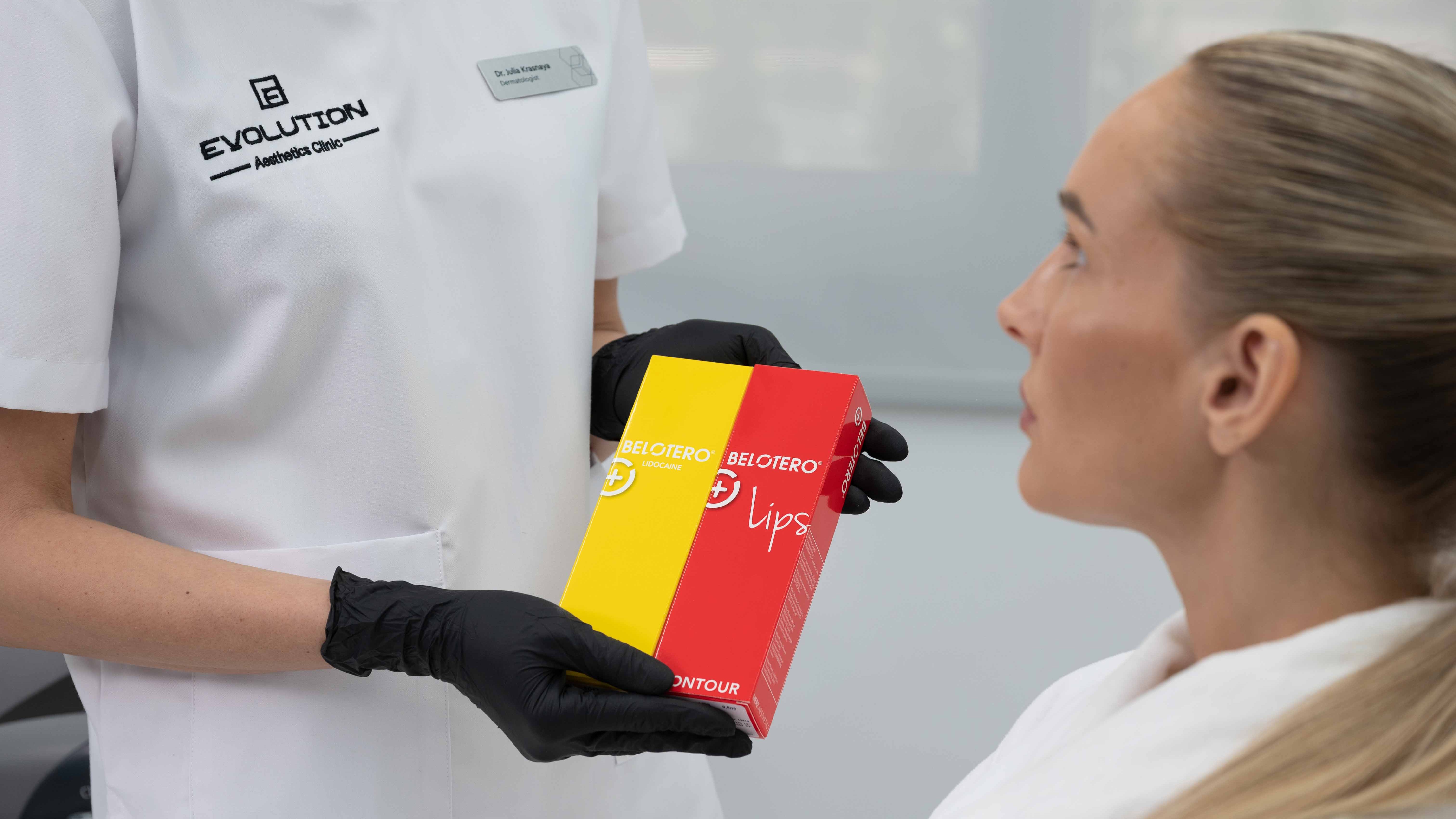Only shot that names a lip-specific filler product; consultation about product choice fits the duration question