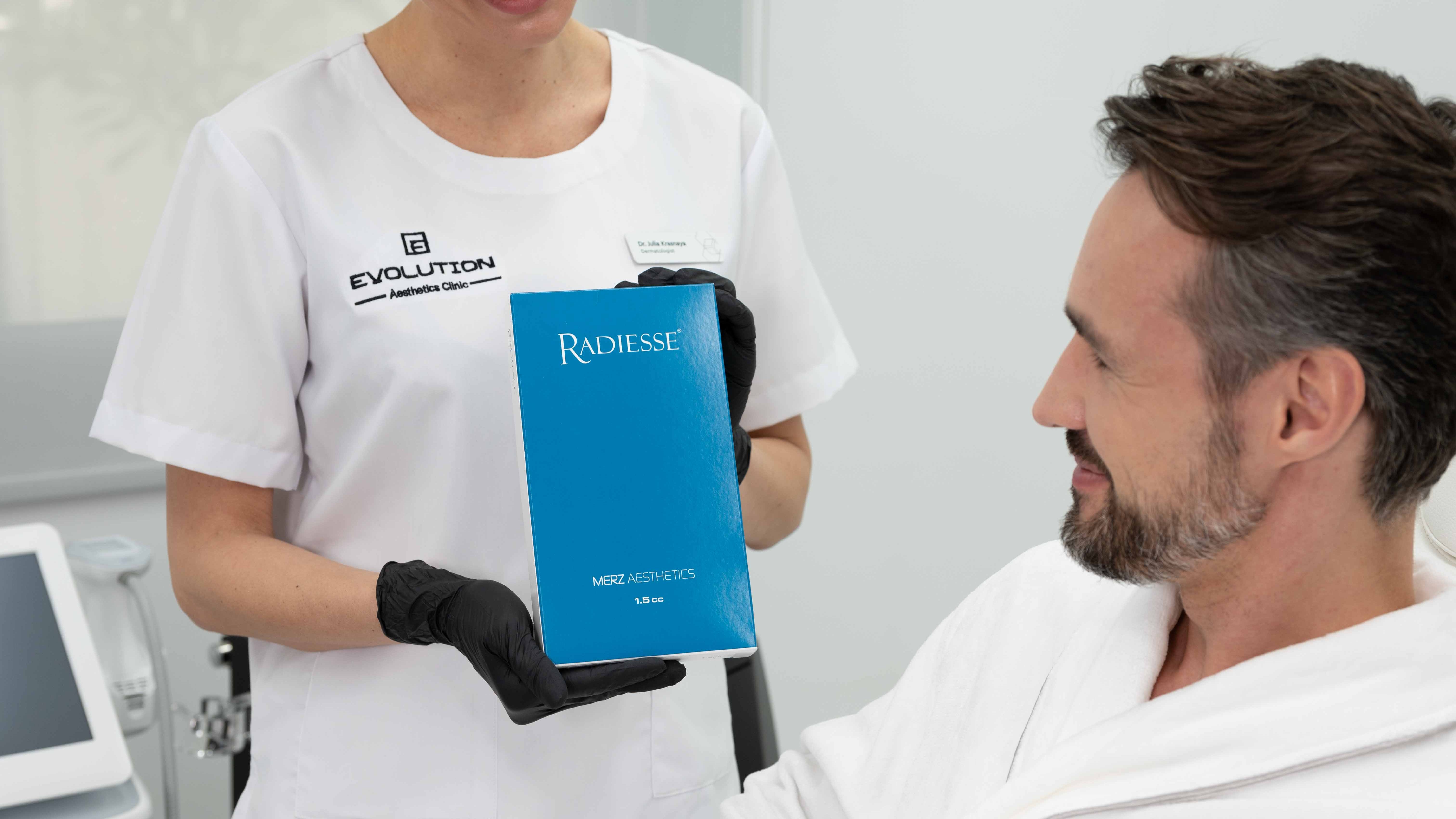 Product-with-patient consultation, reads as explaining the treatment before/after care; landscape source