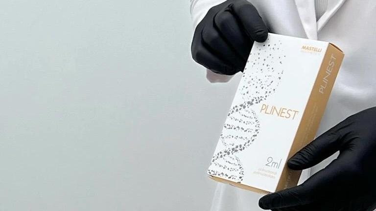 A clinician presents a Plinest product box in gloved hands